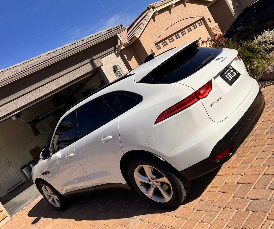Side view of a white Jaguar after exterior detail